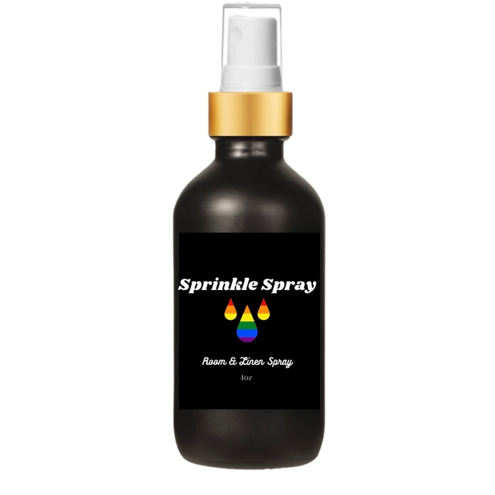 Black bottle Sprinkle Spray LGBTQ+ Pride room spray with rainbow colored water drops the a gold spray pump