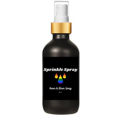 Black bottle Sprinkle Spray LGBTQ+ Pride room spray with rainbow colored water drops the a gold spray pump