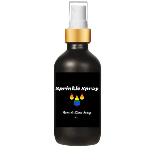 Black bottle Sprinkle Spray LGBTQ+ Pride room spray with rainbow colored water drops the a gold spray pump